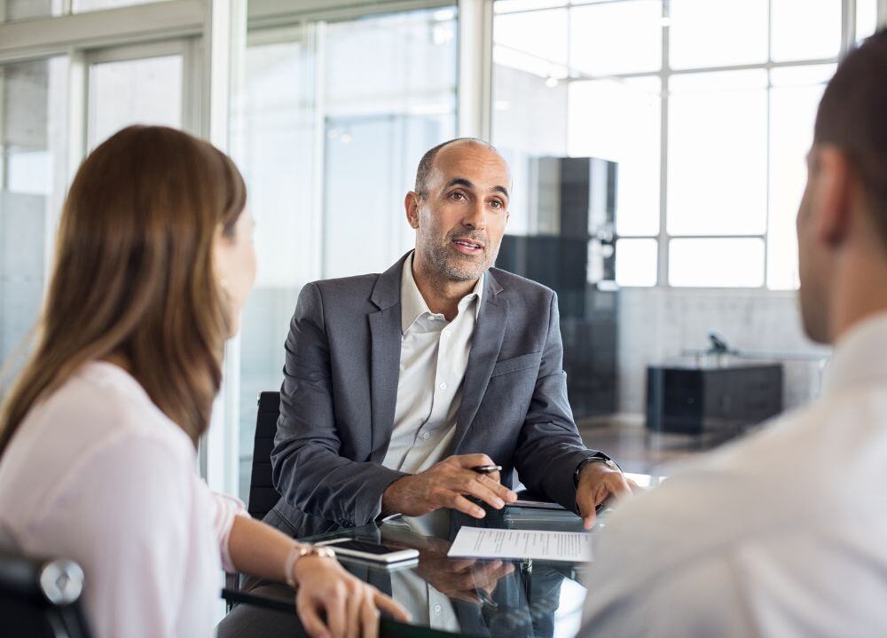 Financial advisor speaking to clients