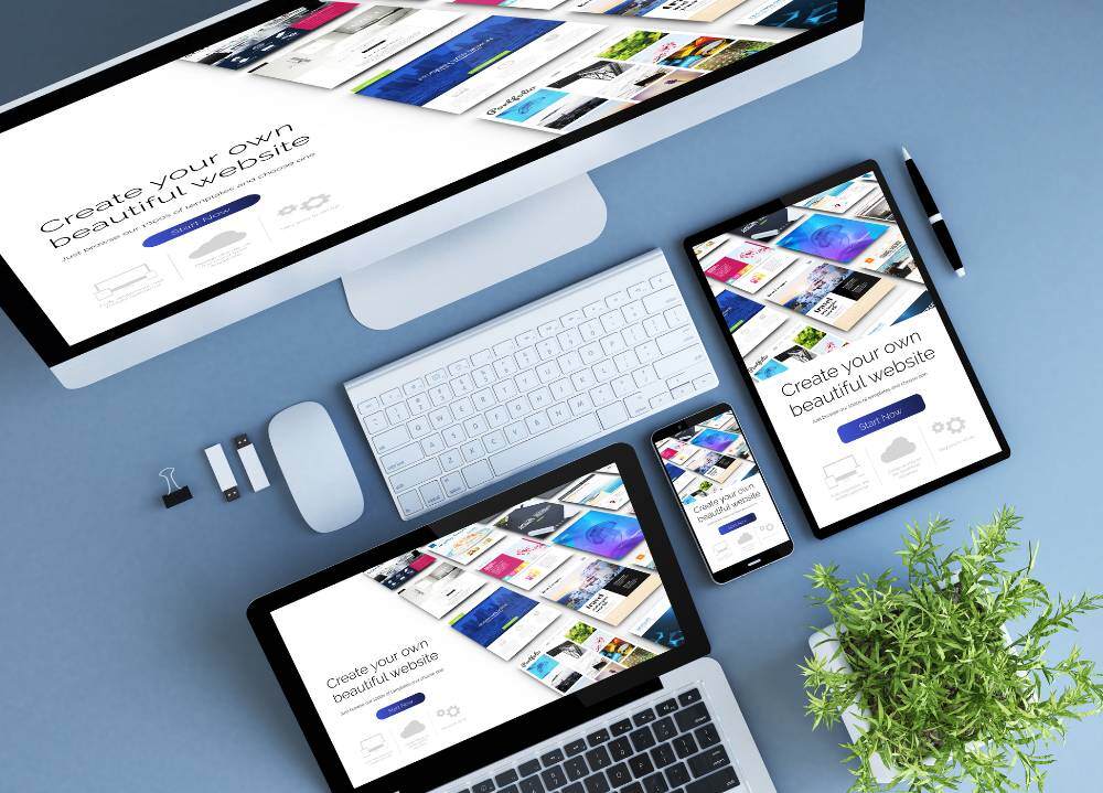 Website development website is pulled up on laptop and tablet.